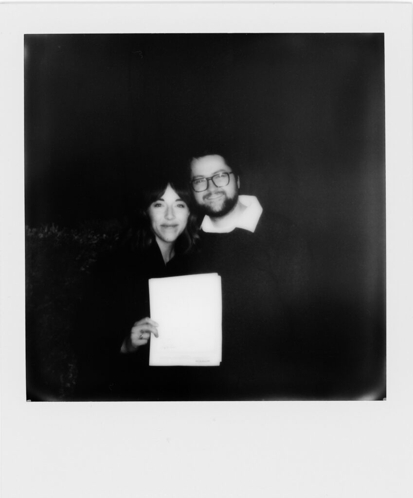 Black and white Polaroid of Elisha and Todd.